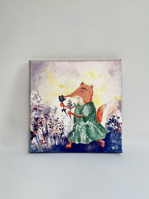 A fox in a green dress holding a posy, standing among white blossom on a pale pink ground.