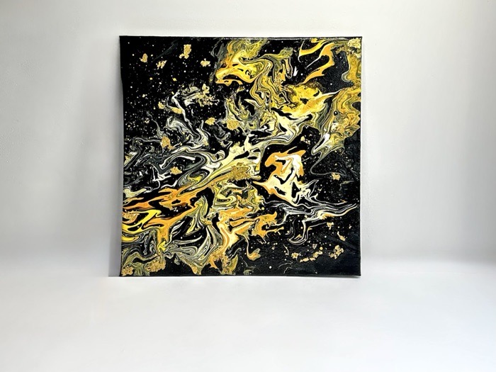 Abstract poured painting, gold veining spreading across a black square canvas.