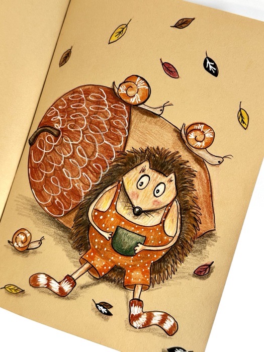 Sketchbook page: a hedgehog in an orange jumper.